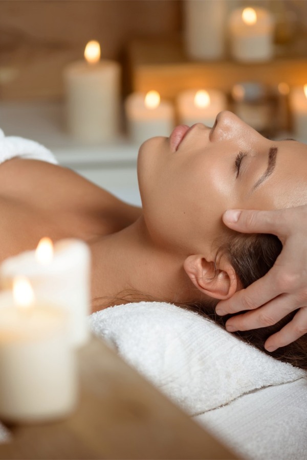 young-woman-having-face-massage-relaxing-spa-salon